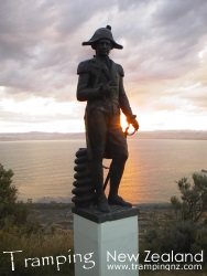 Sunset at Poverty Bay looking towards Young Nicks Head, Captain Cook statue in foreground